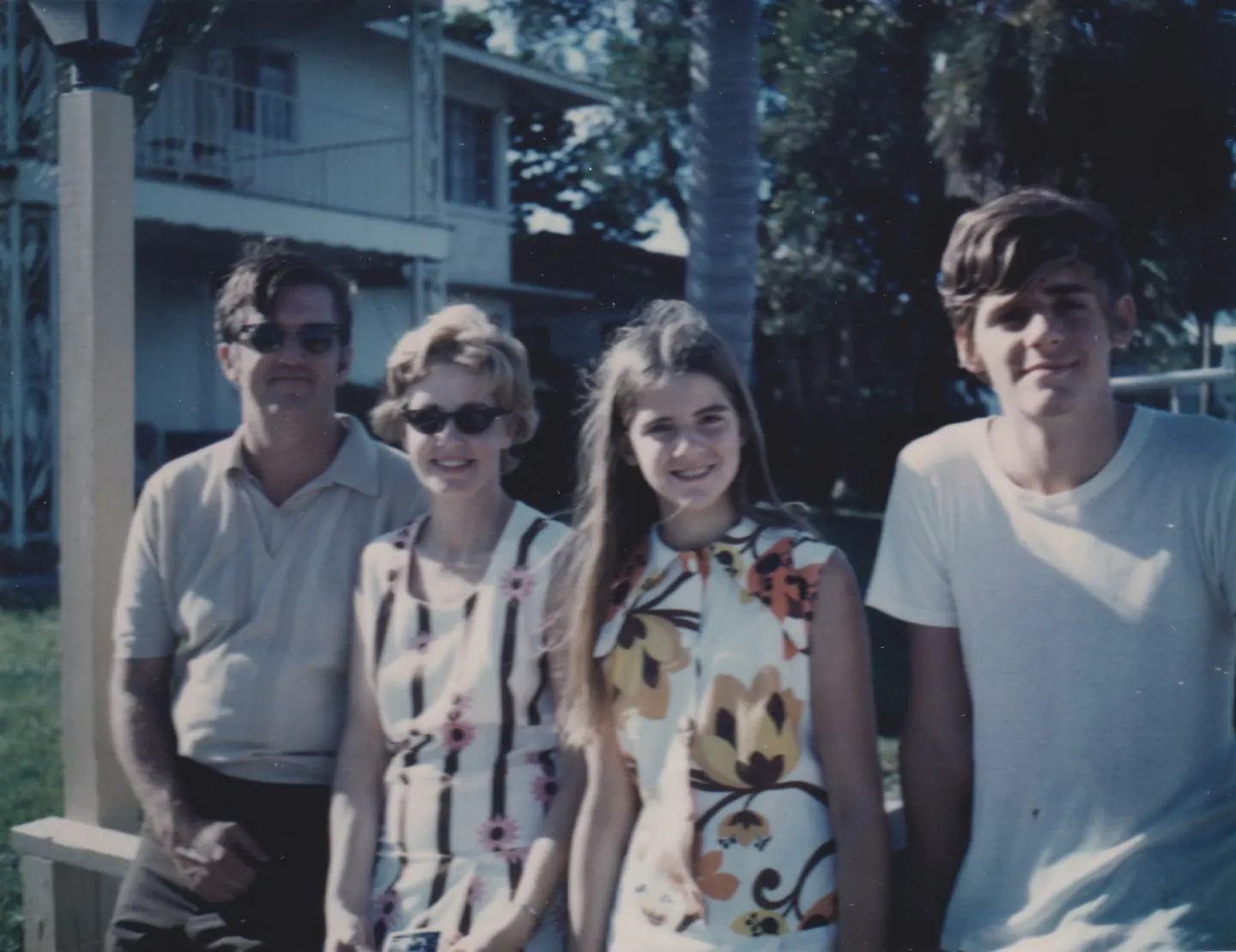 Michael, Helen, Lila and Jeff Shaara stand together outside a house in Florida, early 1970s.